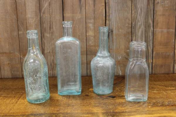 Assorted Sea Green Bottles-M Vintique Rental WI